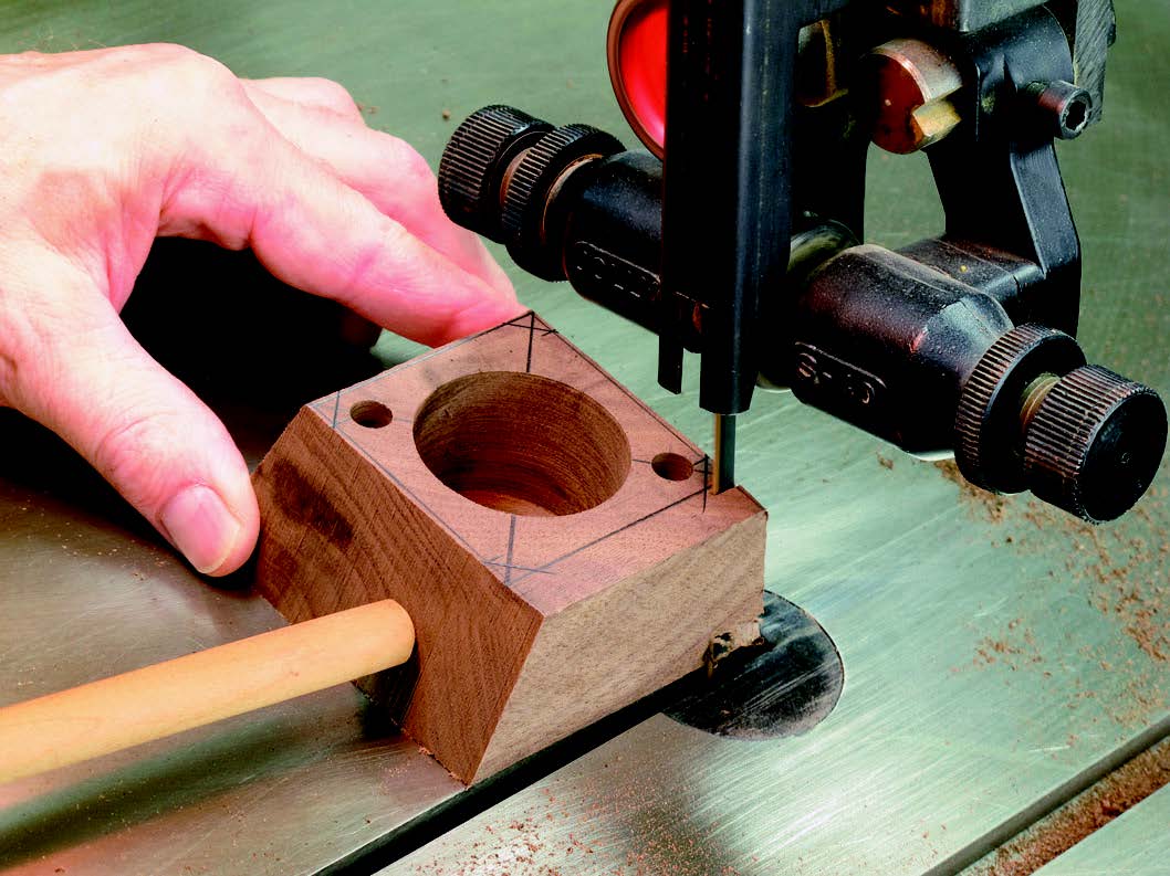 Rough-cut the 14˚ beveled edges of the base sides. Do the sides first, and then the corners. Be careful: drive the base past the band saw blade with a push stick.