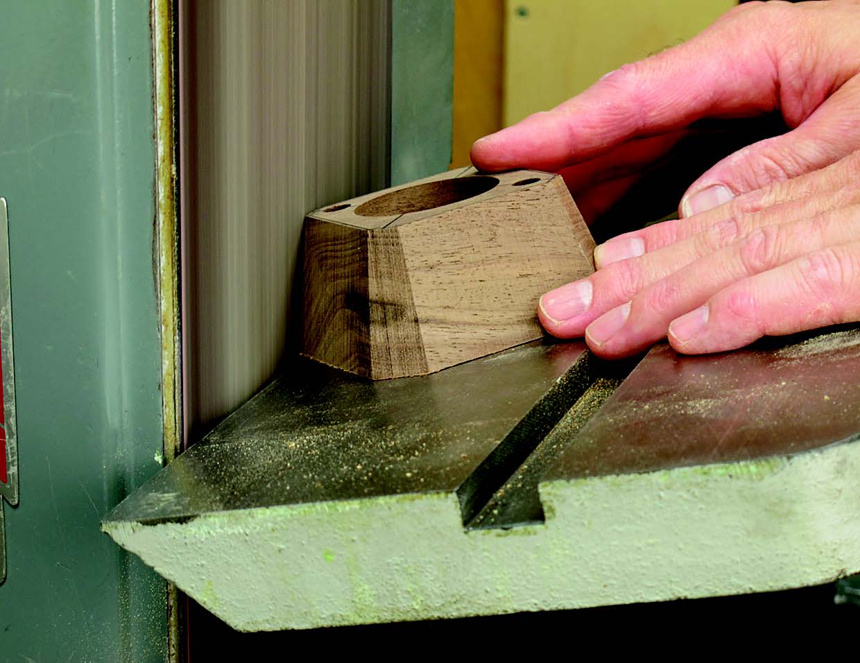 Use a stationary belt or disc sander to define and finish-sand the edges of the base. Start with 120-grit sandpaper, then use 180-grit, and finish with 240-grit on a flat sanding block.