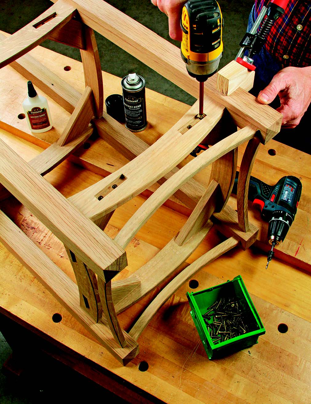 A simple way to install these corner braces is with pairs of screws countersunk into the stopped mortises. The author held the braces in place with CA glue and a clamp before drilling and driving the screws home.