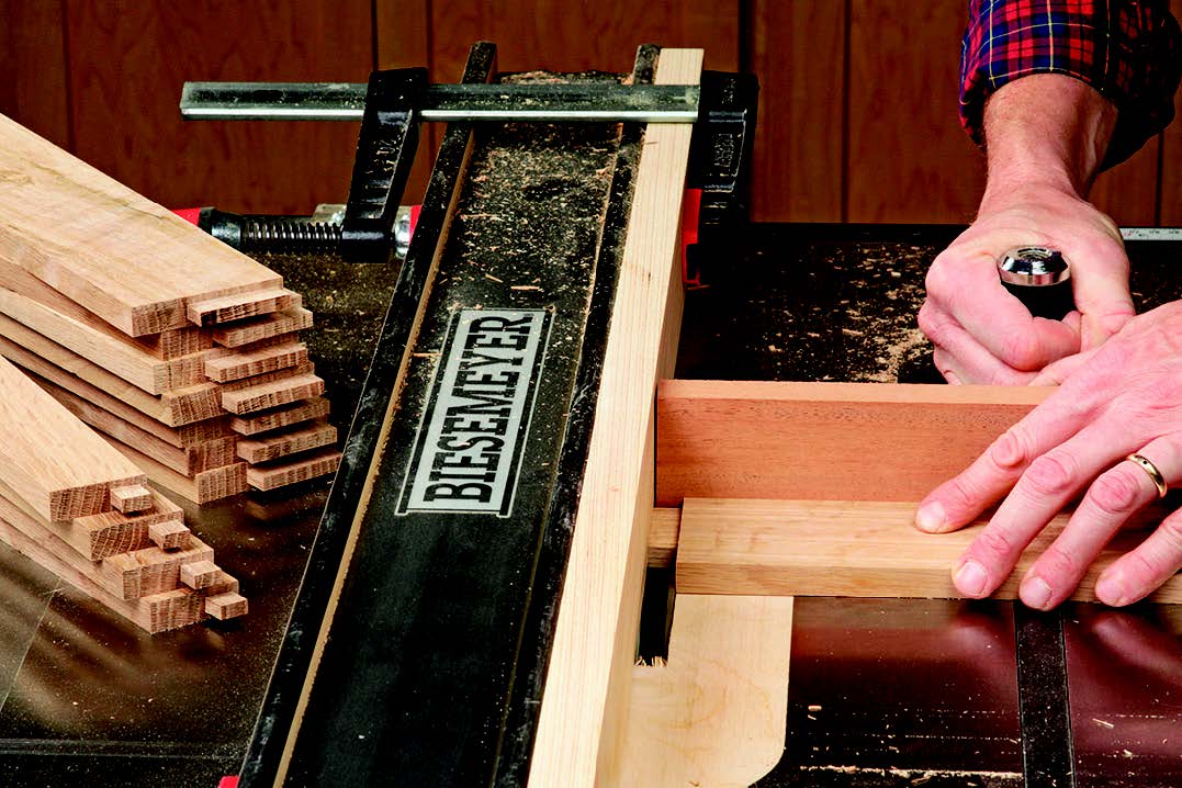 Lower the blade to 1/8" for cutting the broad shoulders on the rails and aprons. These final two cuts bring the tenons to their 1/4" thickness. Make test cuts first, to ensure that the tenons will fit their mortises a bit snug.