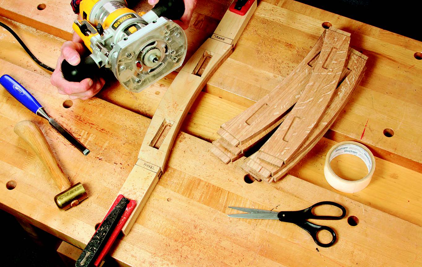 While an apron is still taped under its template, the author mills two 1/4"-deep stopped mortises with a plunge router, 1/2" O.D. guide collar and 1/4" spiral bit. The offset between the collar and bit creates mortises that are 1/2" wide and 2-1⁄4" long.